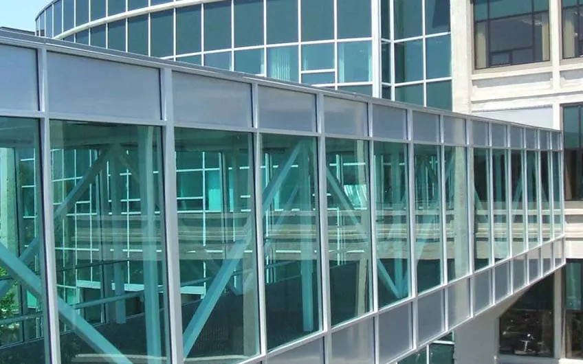 A building covered in green safety netting